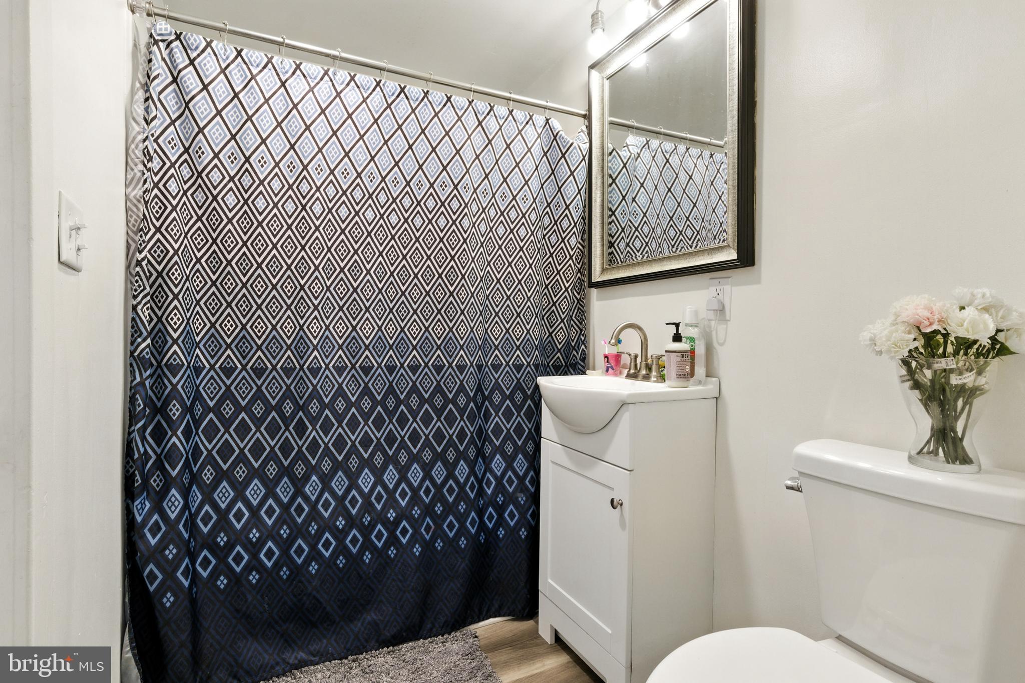 1745 Filbert Street York, PA 17404 - Photo 18 of 26 a bathroom with a sink toilet and a mirror