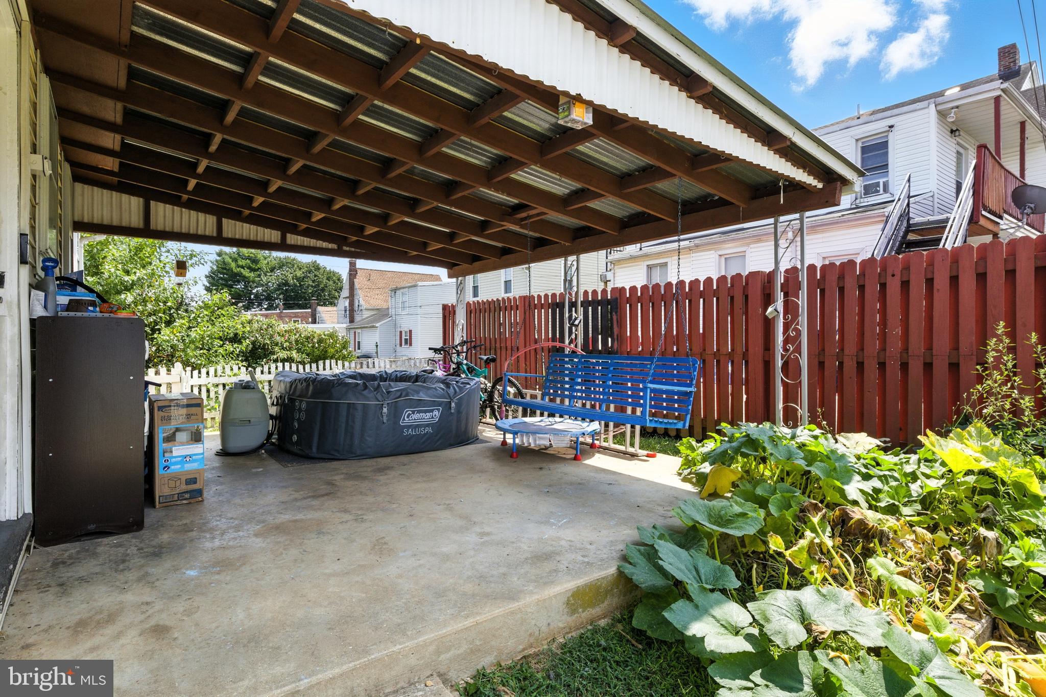 1745 Filbert Street York, PA 17404 - Photo 20 of 26 a view of a backyard with plants and a patio