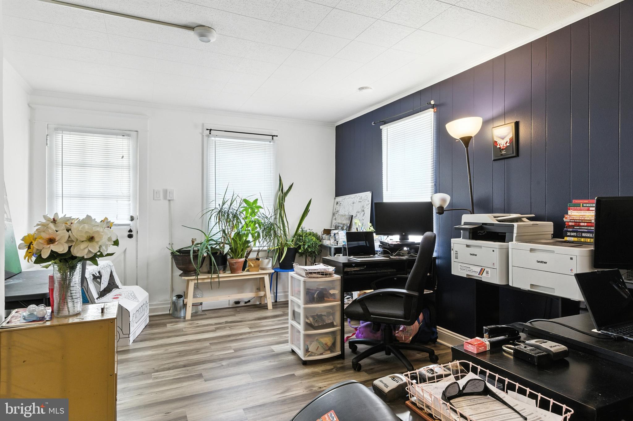 1745 Filbert Street York, PA 17404 - Photo 3 of 26 a work room with furniture and wooden floor