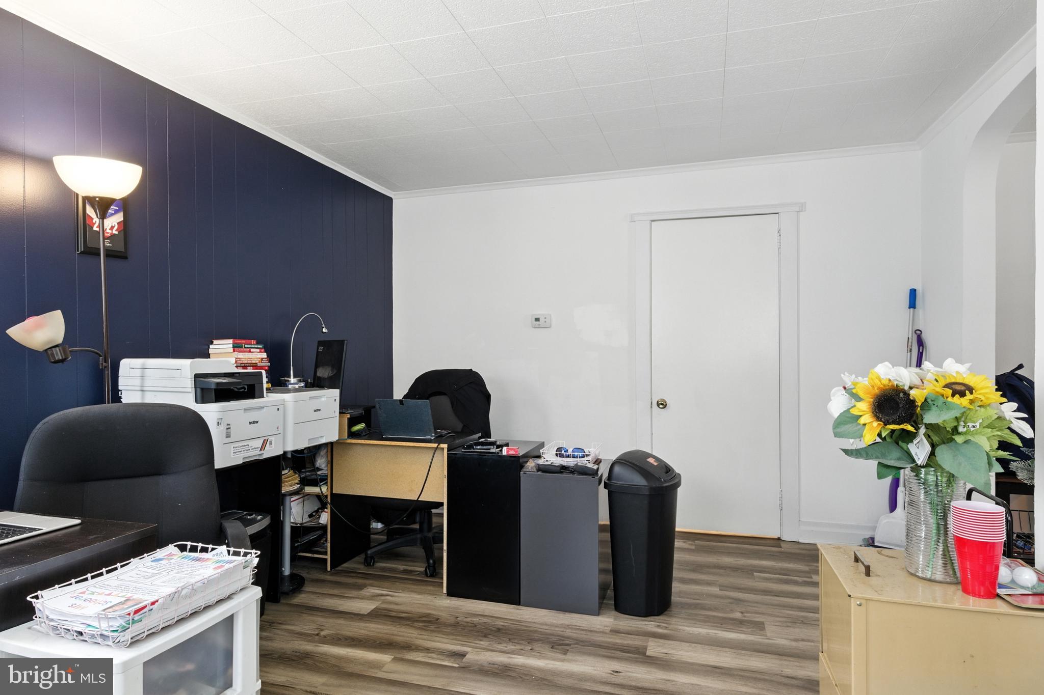 1745 Filbert Street York, PA 17404 - Photo 4 of 26 a dining room with furniture and a potted plant