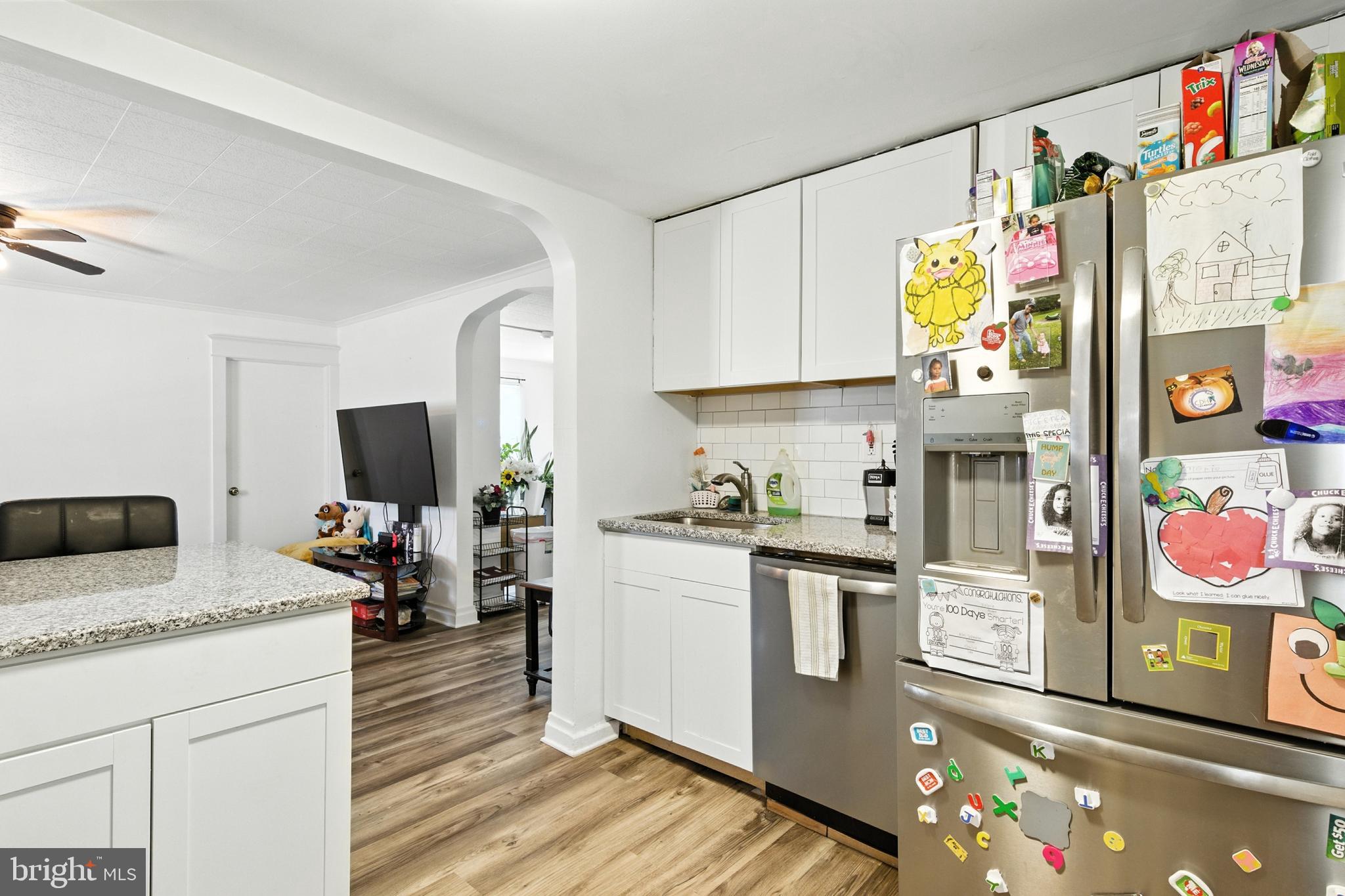 1745 Filbert Street York, PA 17404 - Photo 9 of 26 a kitchen with stainless steel appliances granite countertop a refrigerator and a stove top oven