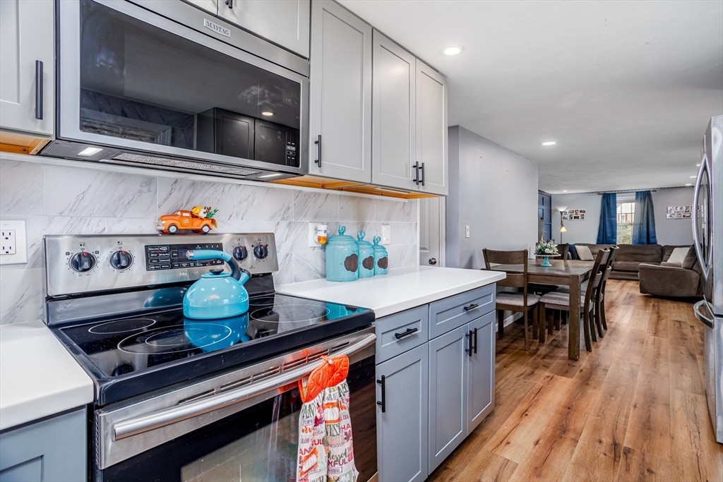18 Corey Hill Road Ashburnham, MA 01430 - Photo 11 of 40 a kitchen with stainless steel appliances granite countertop a stove and cabinets