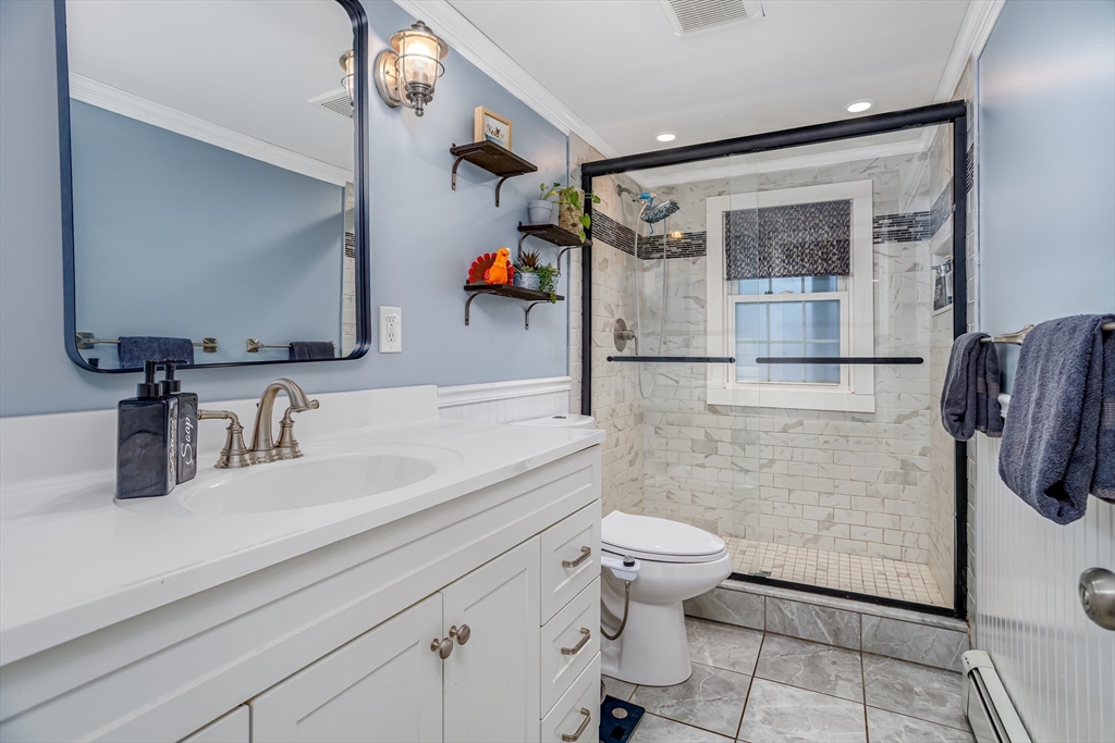 18 Corey Hill Road Ashburnham, MA 01430 - Photo 29 of 40 a bathroom with a sink a toilet and shower