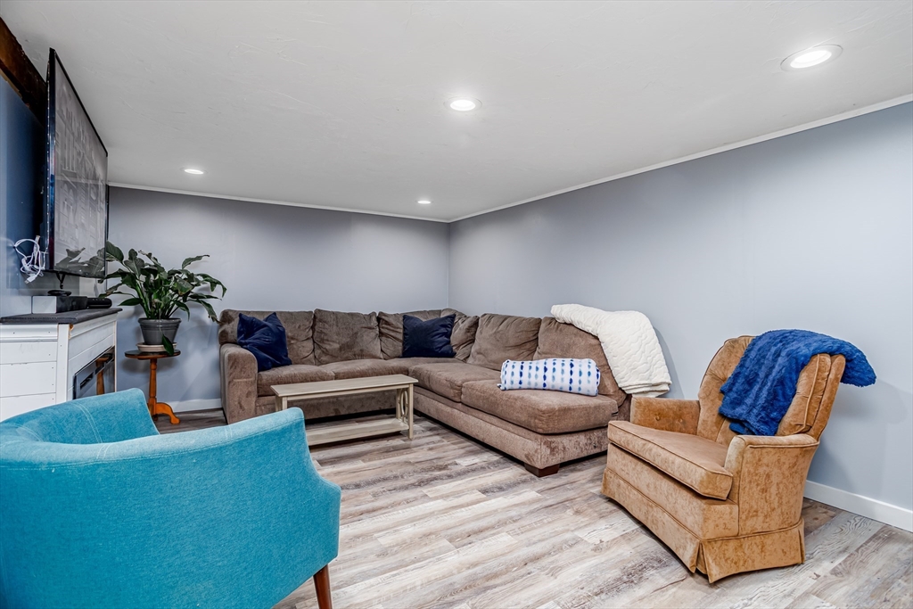 18 Corey Hill Road Ashburnham, MA 01430 - Photo 30 of 40 a living room with furniture potted plant and kitchen view