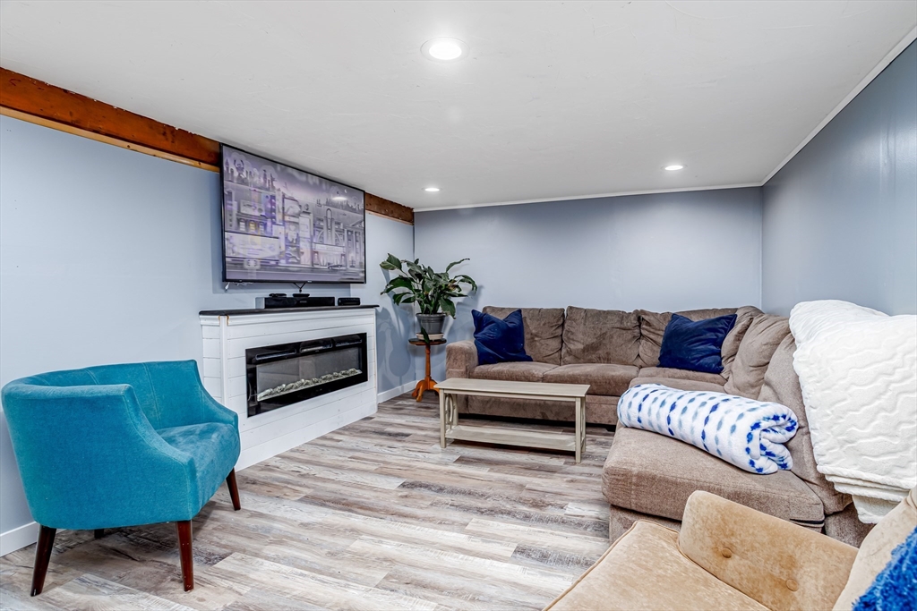 18 Corey Hill Road Ashburnham, MA 01430 - Photo 31 of 40 a living room with furniture and a fireplace