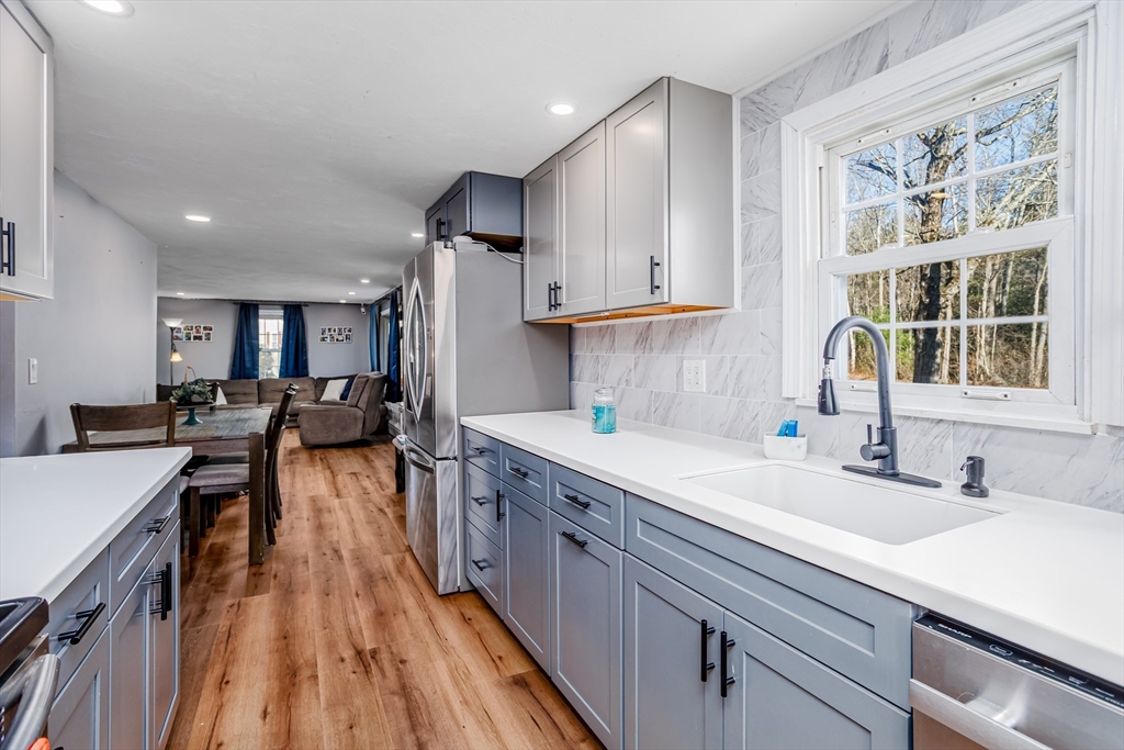 18 Corey Hill Road Ashburnham, MA 01430 - Photo 10 of 40 a kitchen with counter top space a sink appliances and cabinets