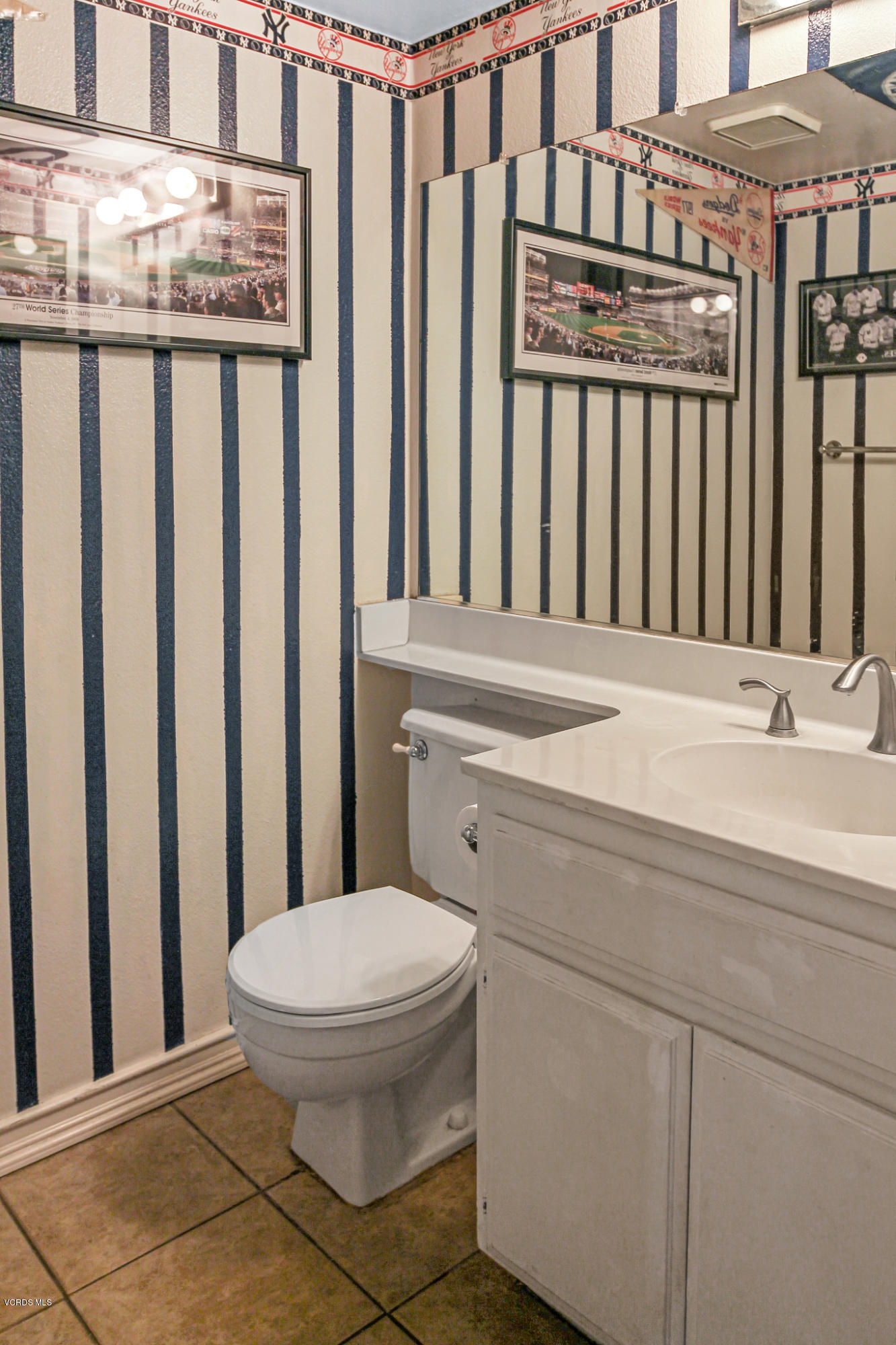 3534 Olds Road Oxnard, CA 93033 - Photo 7 of 14 a bathroom with a granite countertop sink and a toilet