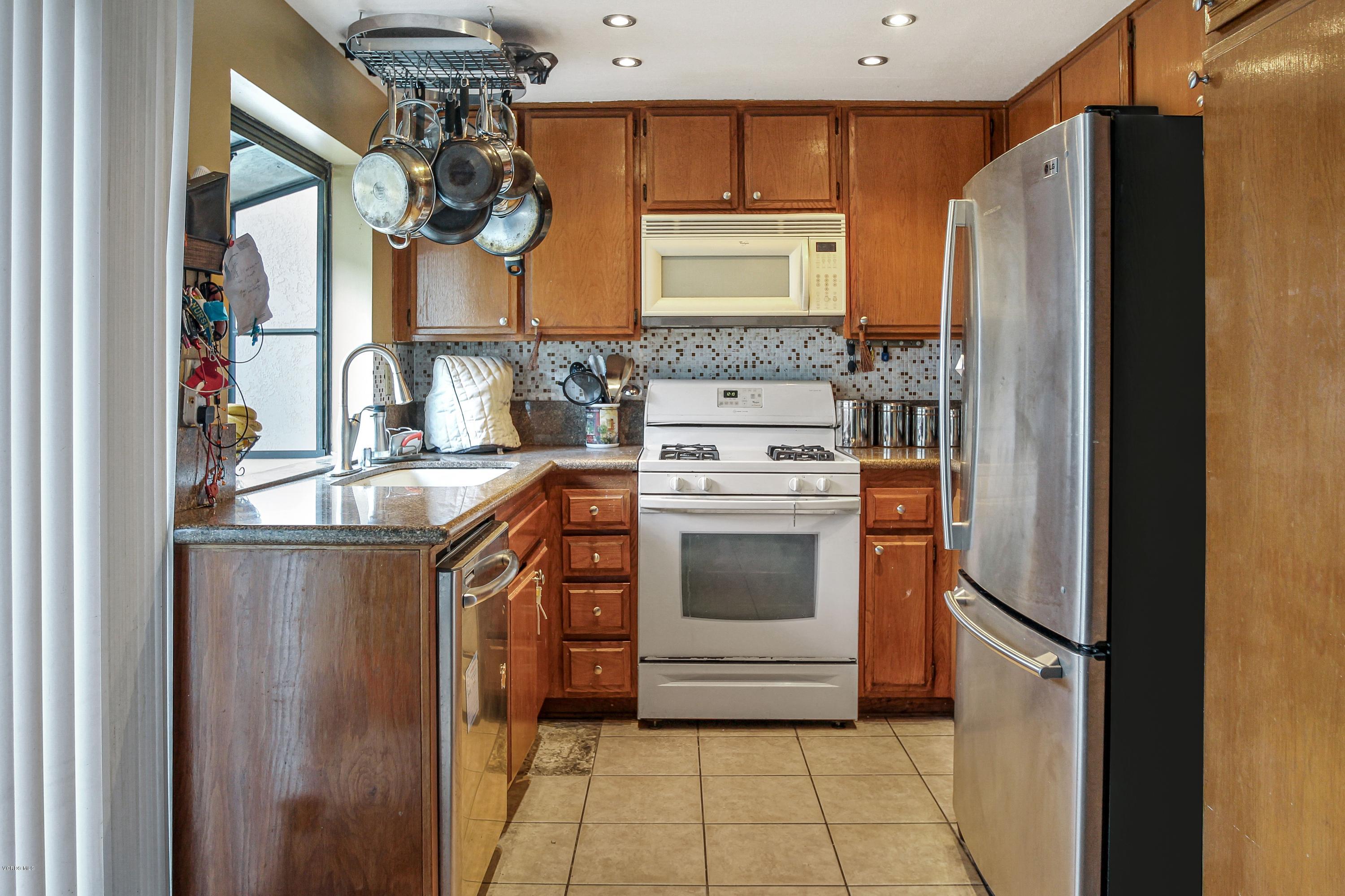3534 Olds Road Oxnard, CA 93033 - Photo 8 of 14 a kitchen with a refrigerator sink and stove