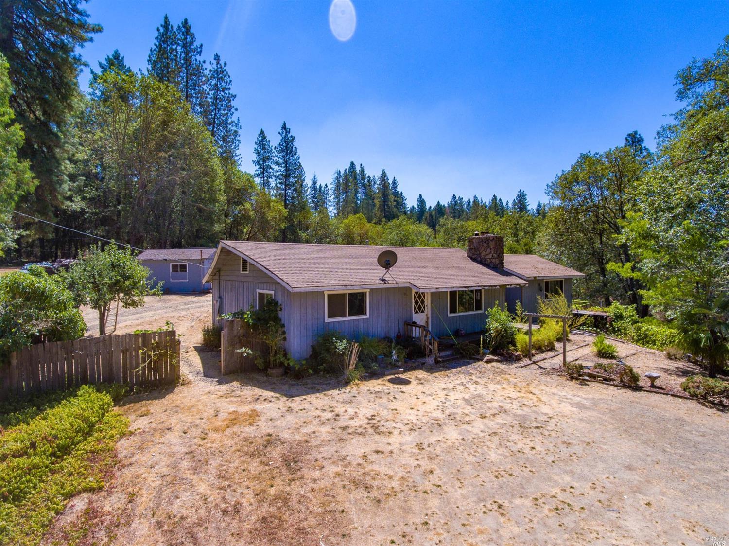 22619 Eastside Road Willits, CA 95490 - Photo 1 of 1 a view of a house with a yard and sitting area