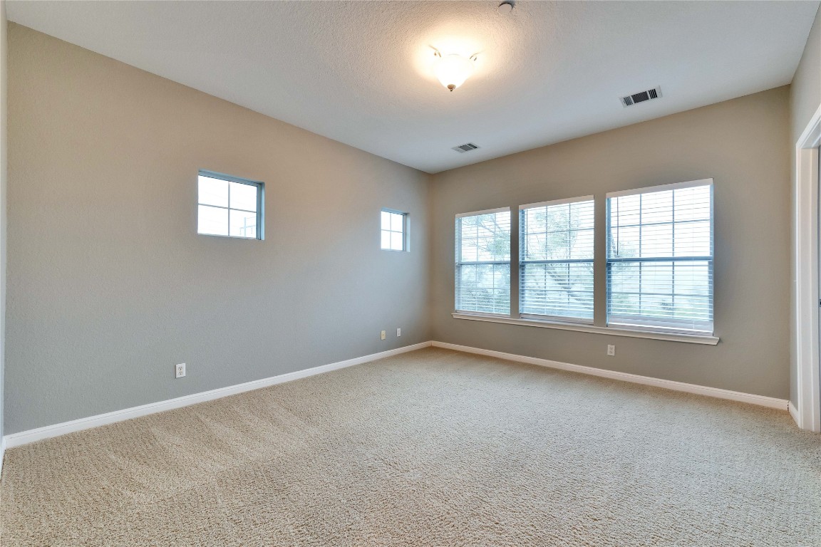 10300 Morado Cove, Unit 601 Austin, TX 78759 - Photo 13 of 20 an empty room with a window