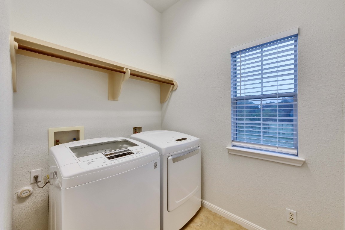 10300 Morado Cove, Unit 601 Austin, TX 78759 - Photo 17 of 20 a utility room with dryer and washer