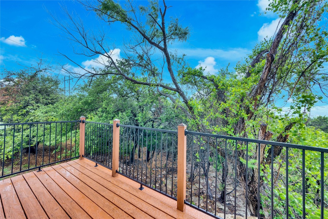 10300 Morado Cove, Unit 601 Austin, TX 78759 - Photo 5 of 20 a view of balcony with wooden floor and fence