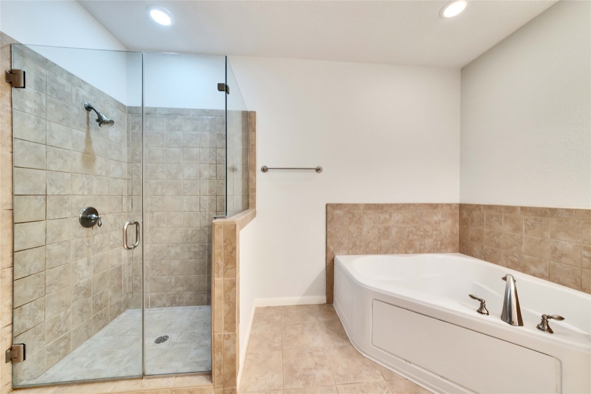 10300 Morado Cove, Unit 601 Austin, TX 78759 - Photo 9 of 20 a bathroom with a bathtub and shower