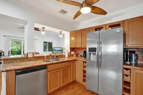 a view of a workspace with furniture and wooden floor