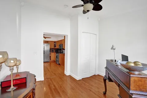 a bedroom with furniture and a mirror