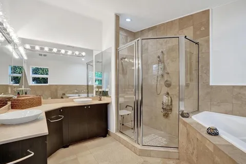 a spacious bedroom with a bed and a window