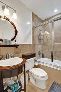 a view of a house with a backyard and a patio