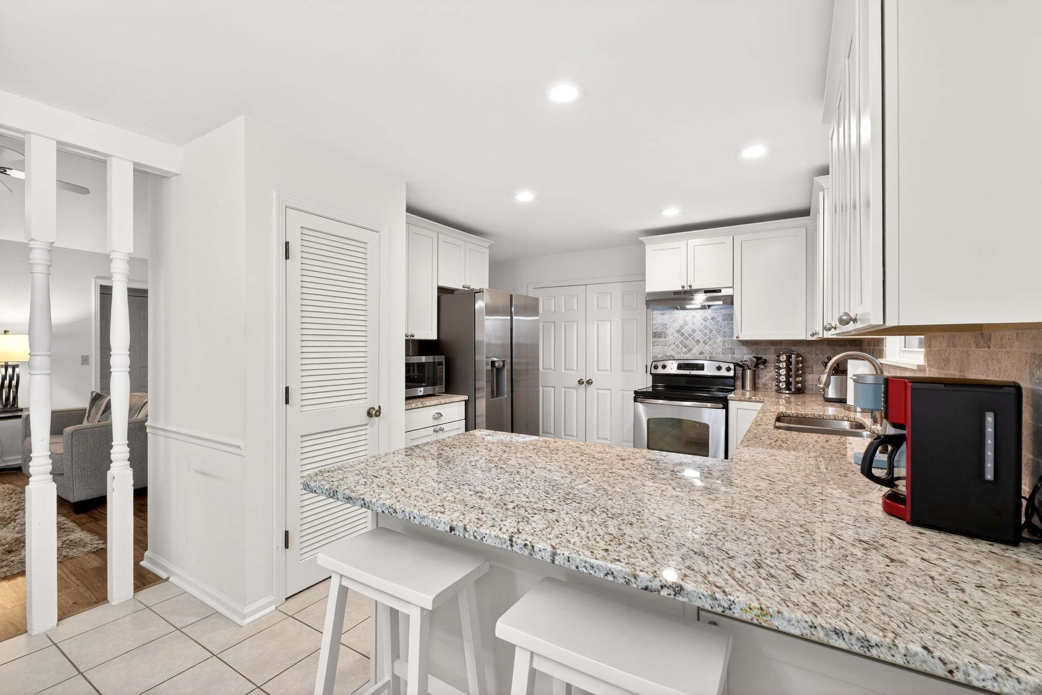 205 Stoneyway Court Nolensville, TN 37135 - Photo 19 of 41 a kitchen with stainless steel appliances kitchen island granite countertop a refrigerator and a stove top oven