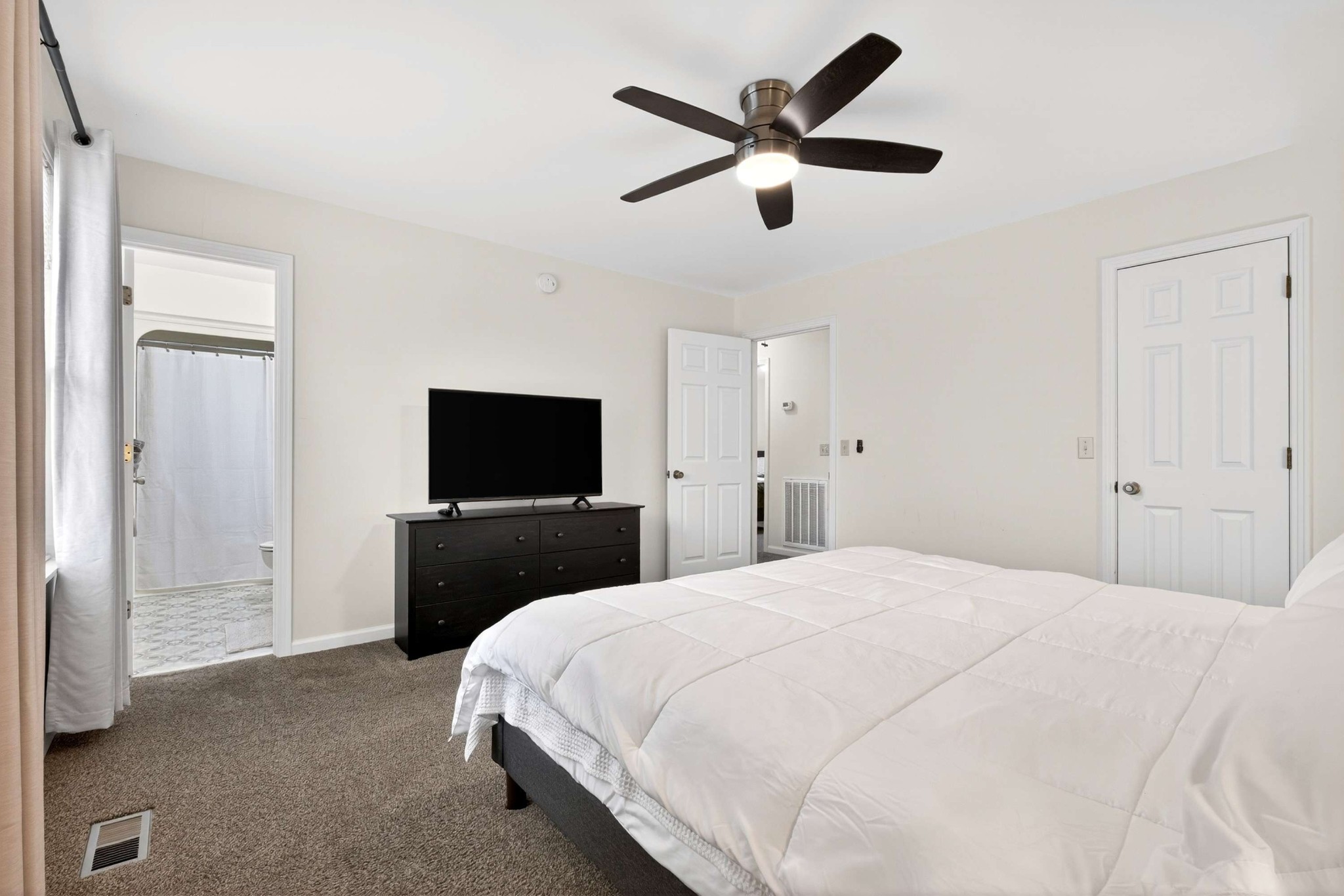 205 Stoneyway Court Nolensville, TN 37135 - Photo 27 of 41 a bedroom with a bed and a flat screen tv