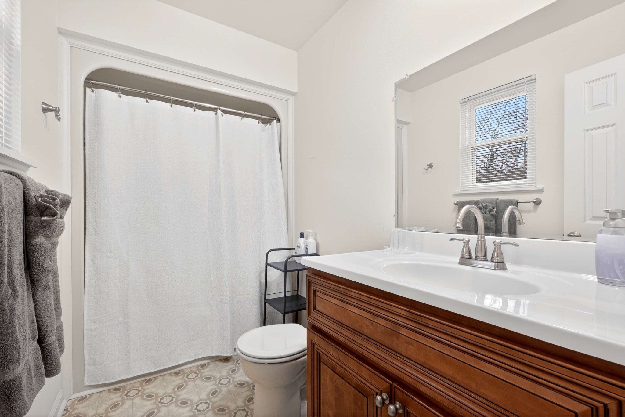 205 Stoneyway Court Nolensville, TN 37135 - Photo 28 of 41 a bathroom with a sink a toilet a mirror and shower