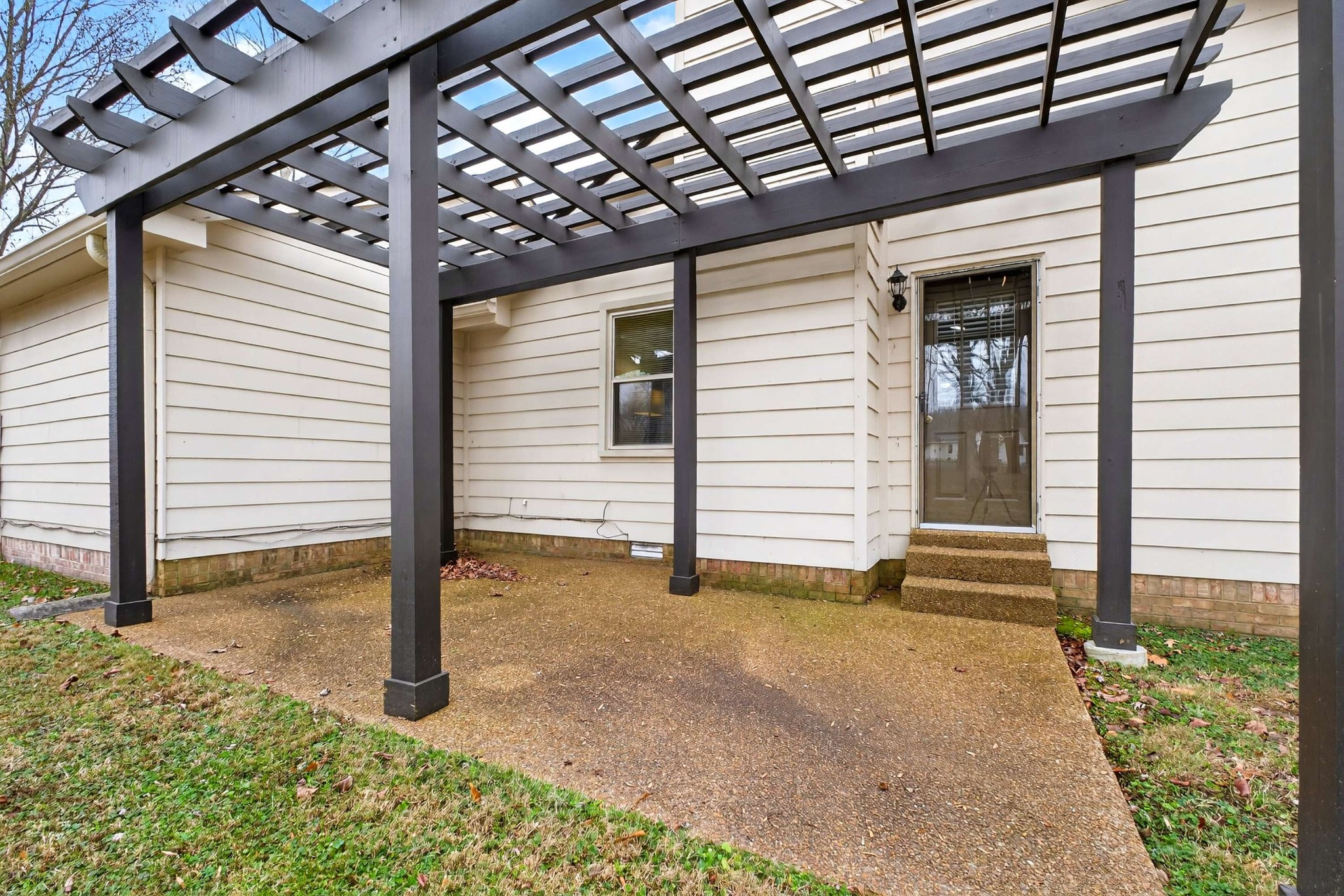 205 Stoneyway Court Nolensville, TN 37135 - Photo 33 of 41 a view of a porch with a table and chair and wooden fence