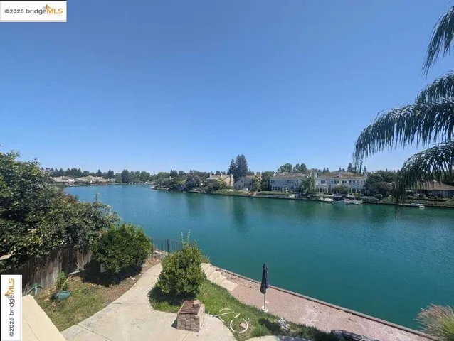 a view of a lake with sitting area