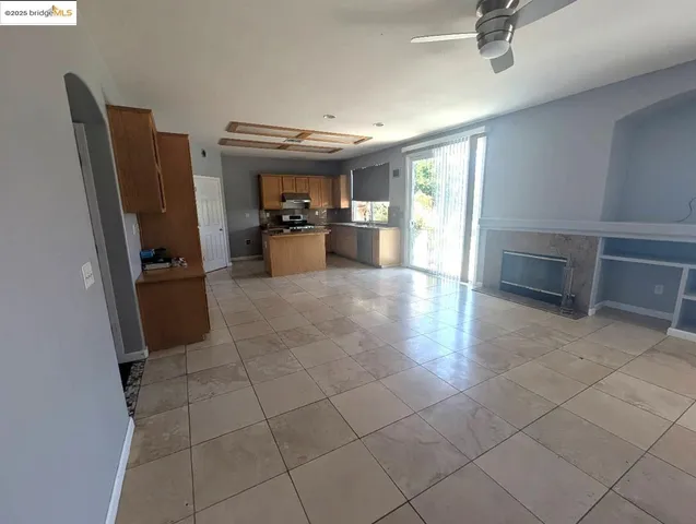 a open kitchen with cabinets and stainless steel appliances