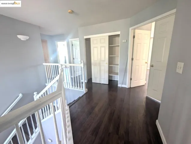 a view of an entryway with wooden floor