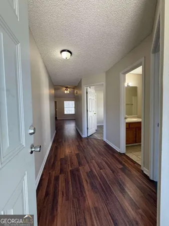 a view of gallery with wooden floor