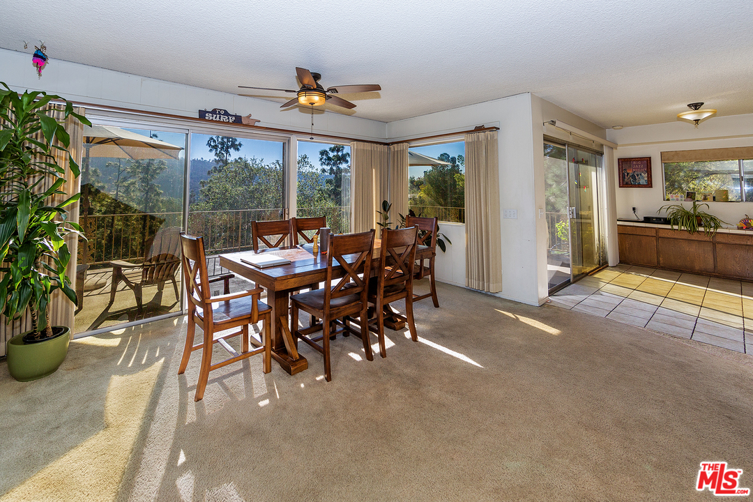 3088 Paddington Road Glendale, CA 91206 - Photo 7 of 17 a view of a dining room with furniture large windows and wooden floor