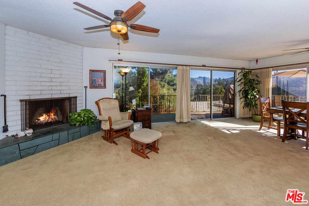 3088 Paddington Road Glendale, CA 91206 - Photo 8 of 17 a living room with furniture and a fireplace