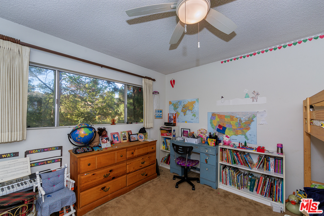 3088 Paddington Road Glendale, CA 91206 - Photo 9 of 17 a room with furniture toys and a window