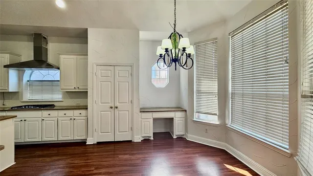 a very nice looking room with wooden floor