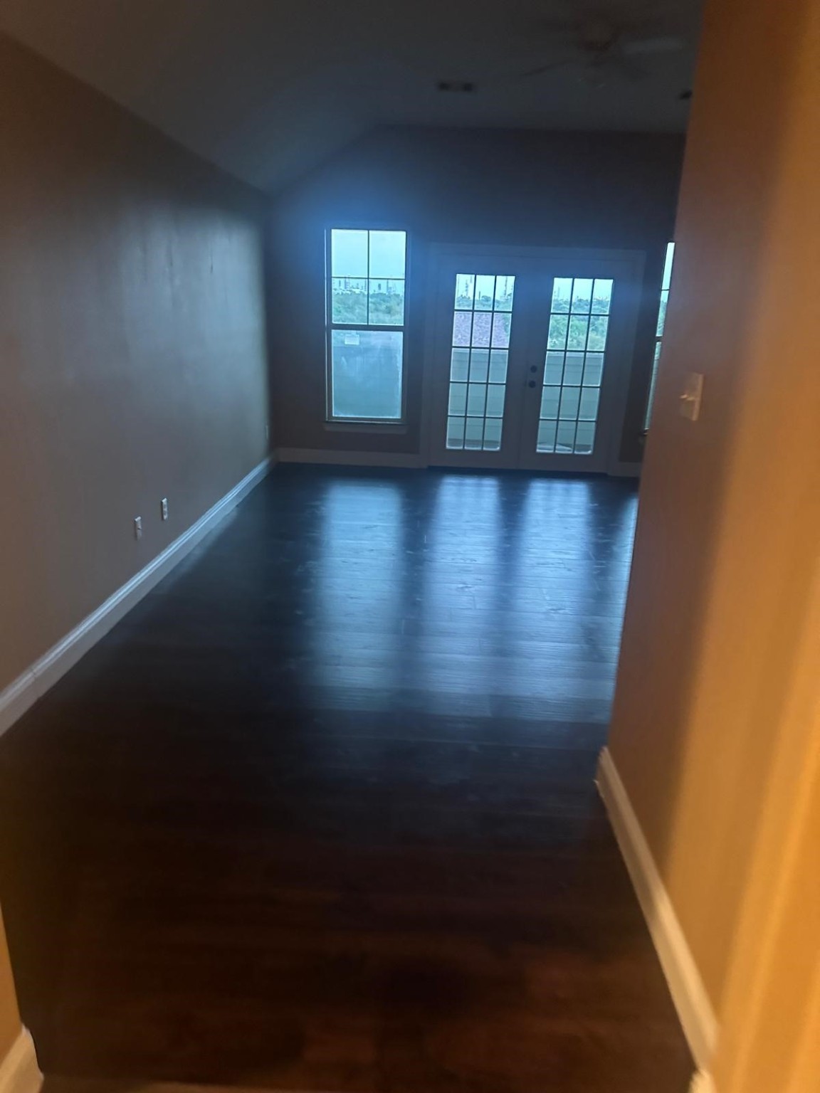 205 Rue Orleans Street Baytown, TX 77520 - Photo 40 of 43 wooden floor in an empty room with a window