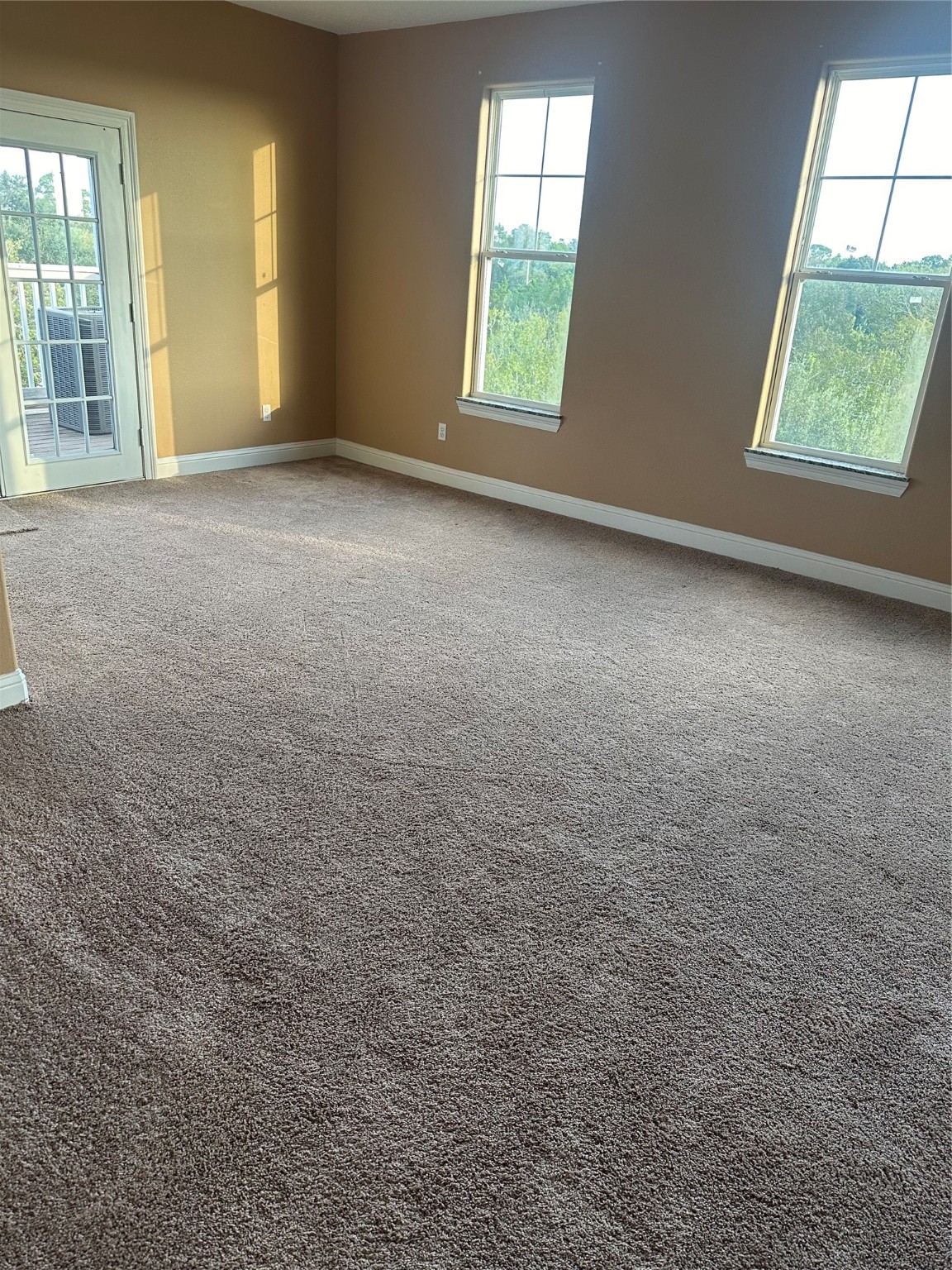 205 Rue Orleans Street Baytown, TX 77520 - Photo 7 of 43 an empty room with windows