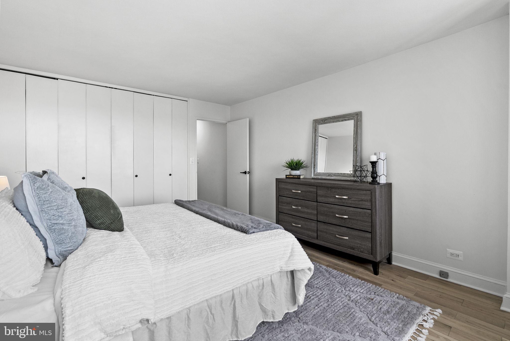 1600 Hagys Ford Road, Unit 8U Penn Valley, PA 19072 - Photo 15 of 44 a bedroom with a bed and a dresser