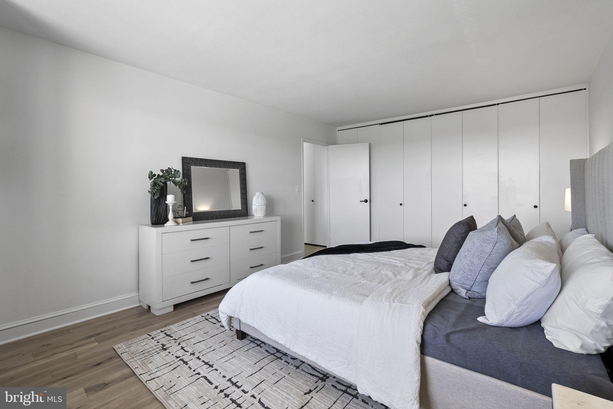 1600 Hagys Ford Road, Unit 8U Penn Valley, PA 19072 - Photo 16 of 44 a bedroom with a bed and a flat screen tv