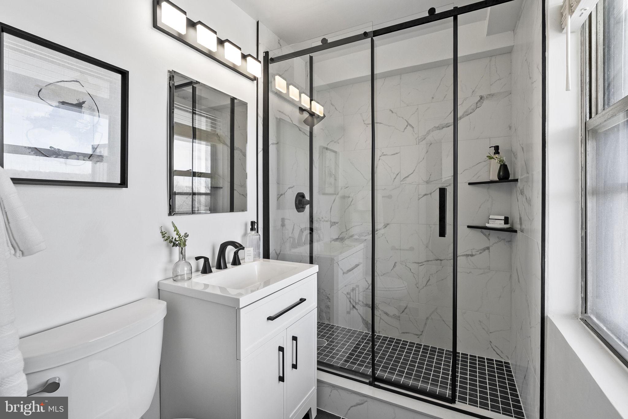 1600 Hagys Ford Road, Unit 8U Penn Valley, PA 19072 - Photo 17 of 44 a bathroom with a shower sink and mirror
