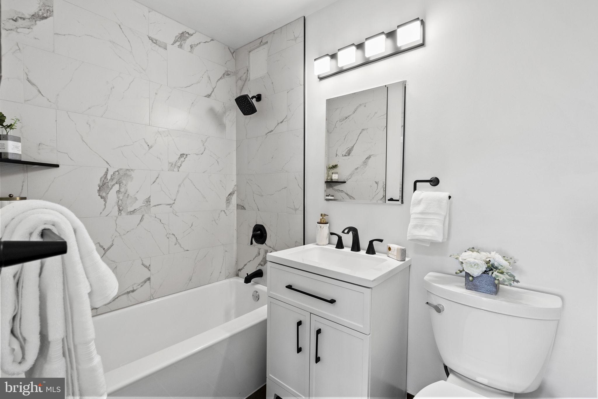 1600 Hagys Ford Road, Unit 8U Penn Valley, PA 19072 - Photo 21 of 44 a bathroom with a sink toilet and shower