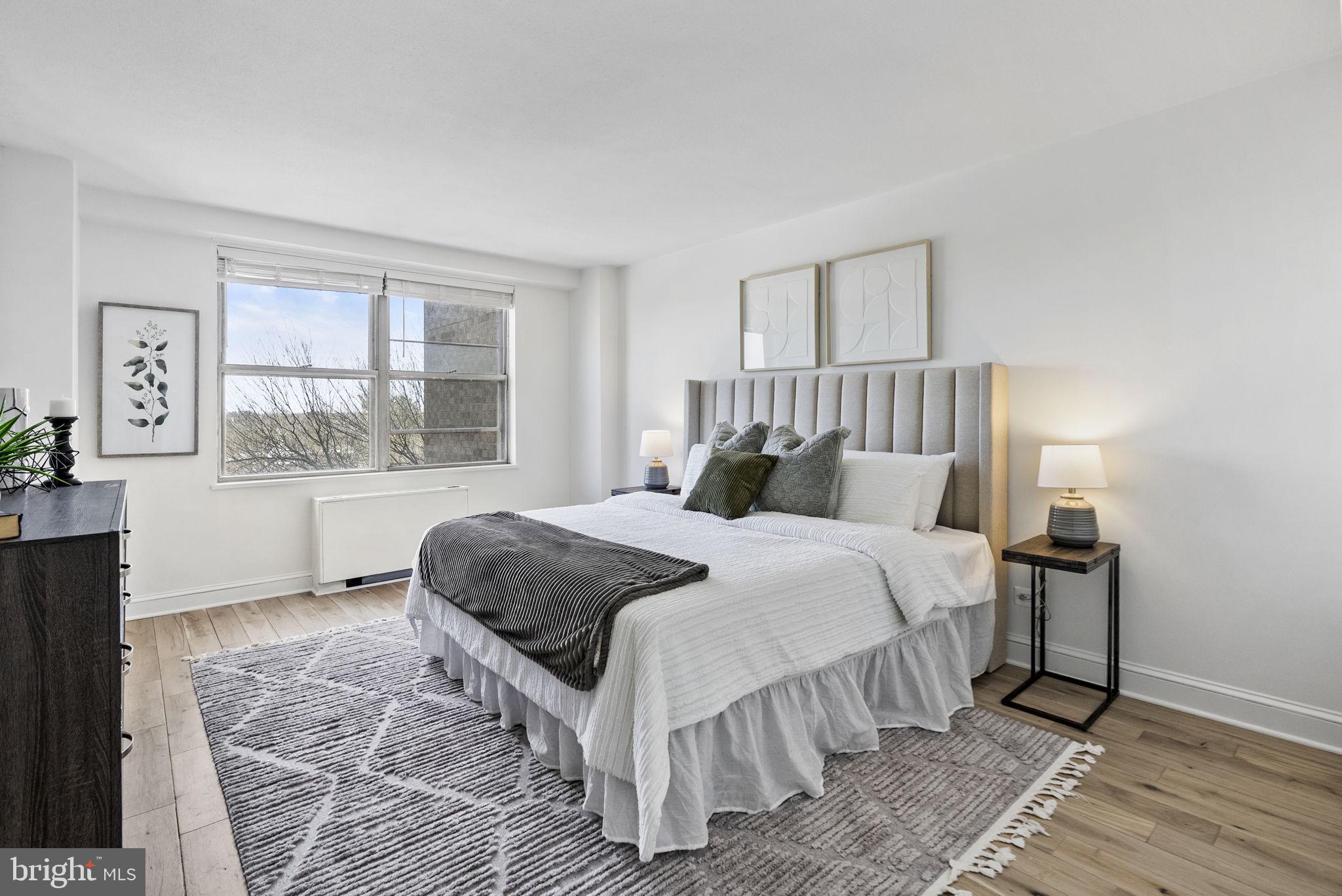 1600 Hagys Ford Road, Unit 8U Penn Valley, PA 19072 - Photo 22 of 44 a bedroom with a large bed and a window