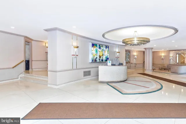 a living room with a couch and a table with wooden floor