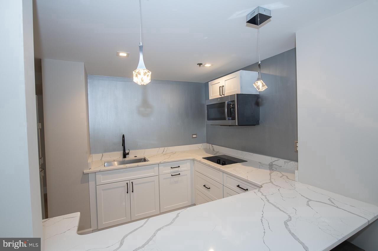 1600 Hagys Ford Road, Unit 8U Penn Valley, PA 19072 - Photo 31 of 44 a bathroom with a sink vanity and mirror