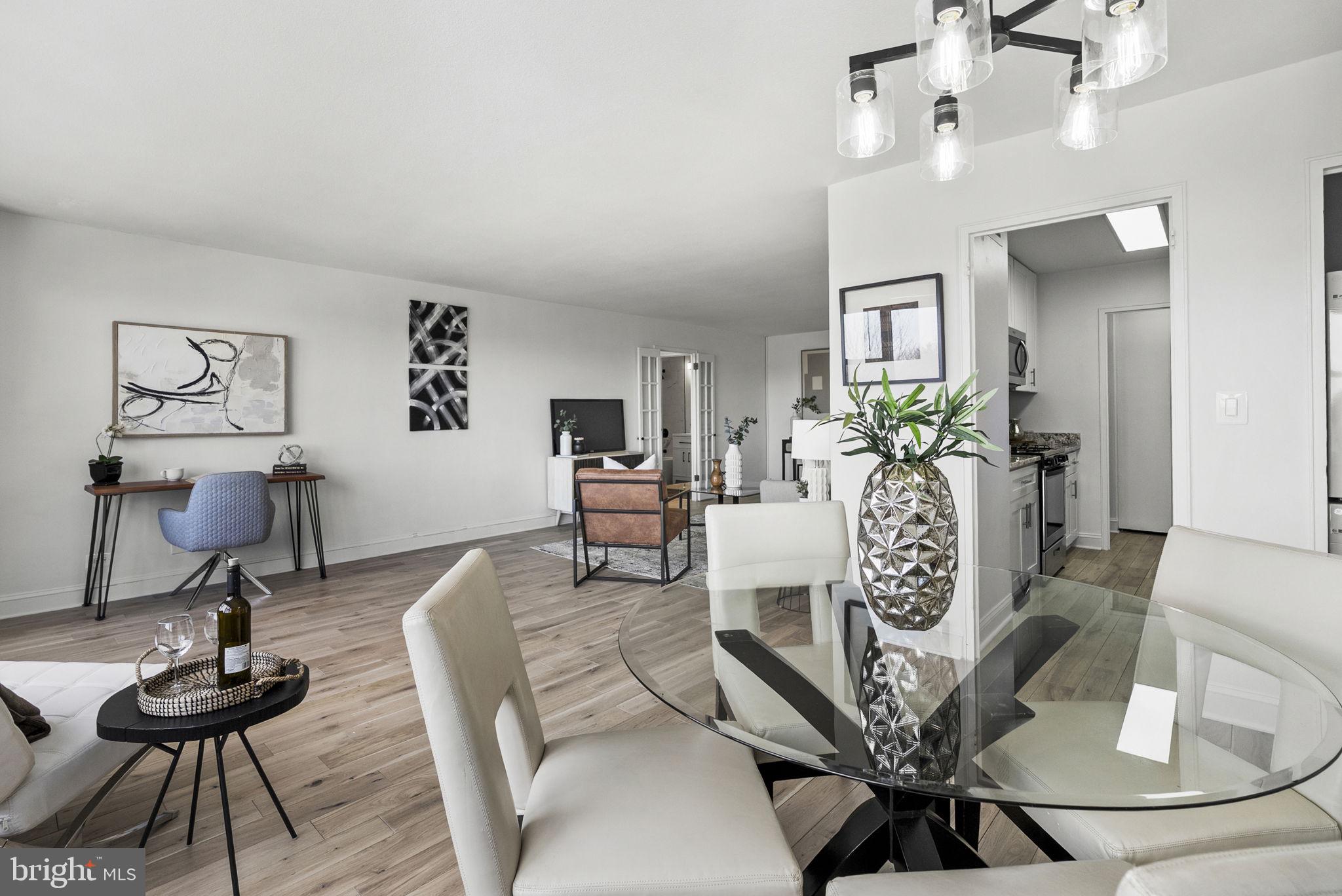 1600 Hagys Ford Road, Unit 8U Penn Valley, PA 19072 - Photo 6 of 44 a living room with furniture and wooden floor