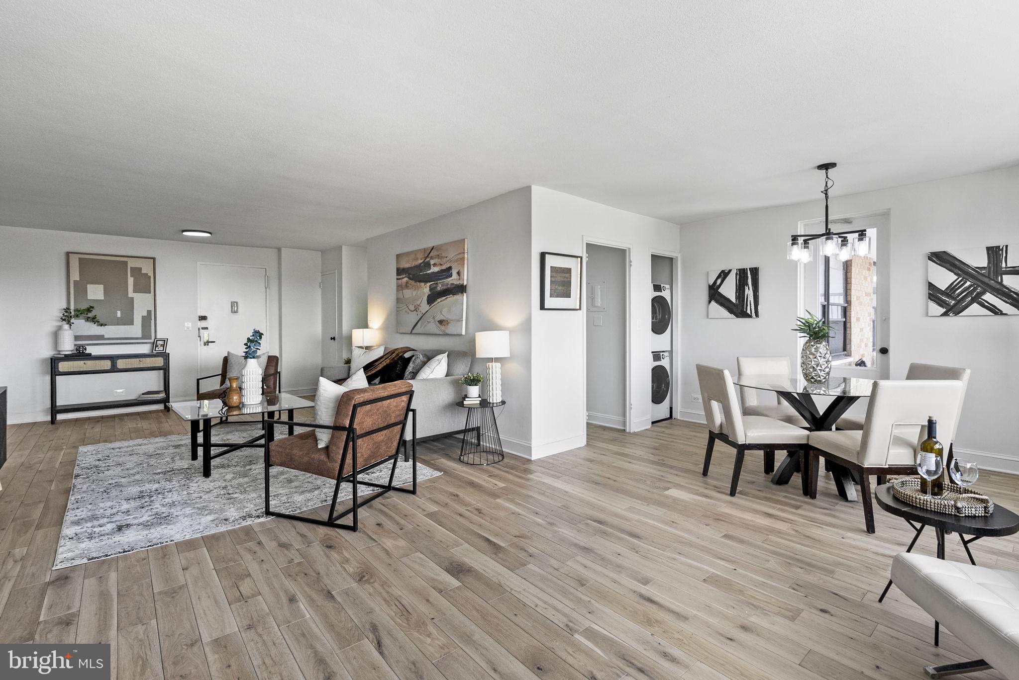 1600 Hagys Ford Road, Unit 8U Penn Valley, PA 19072 - Photo 7 of 44 a living room with furniture dining table and wooden floor
