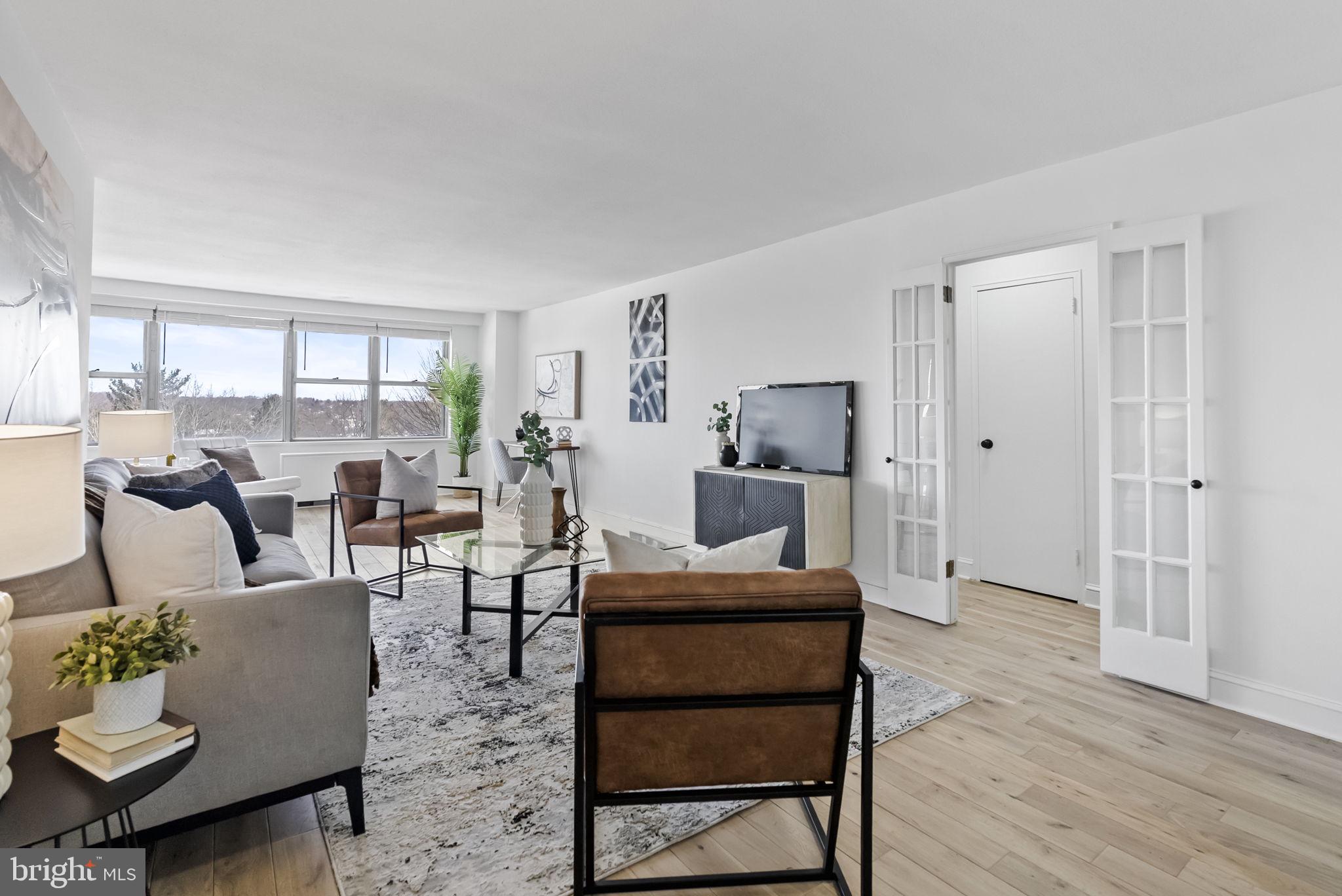 1600 Hagys Ford Road, Unit 8U Penn Valley, PA 19072 - Photo 10 of 44 a living room with furniture and a large window