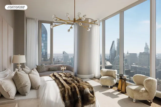 a living room with furniture and large windows