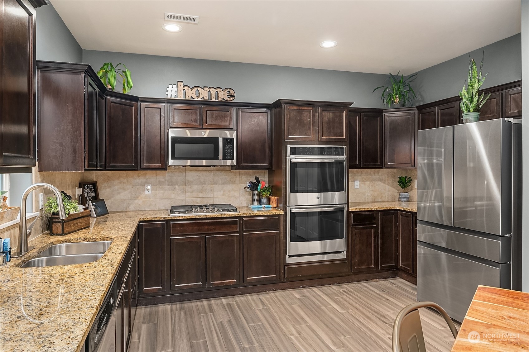 11520 56th Drive Southeast Everett, WA 98208 - Photo 11 of 30 a kitchen with stainless steel appliances granite countertop a refrigerator stove and oven