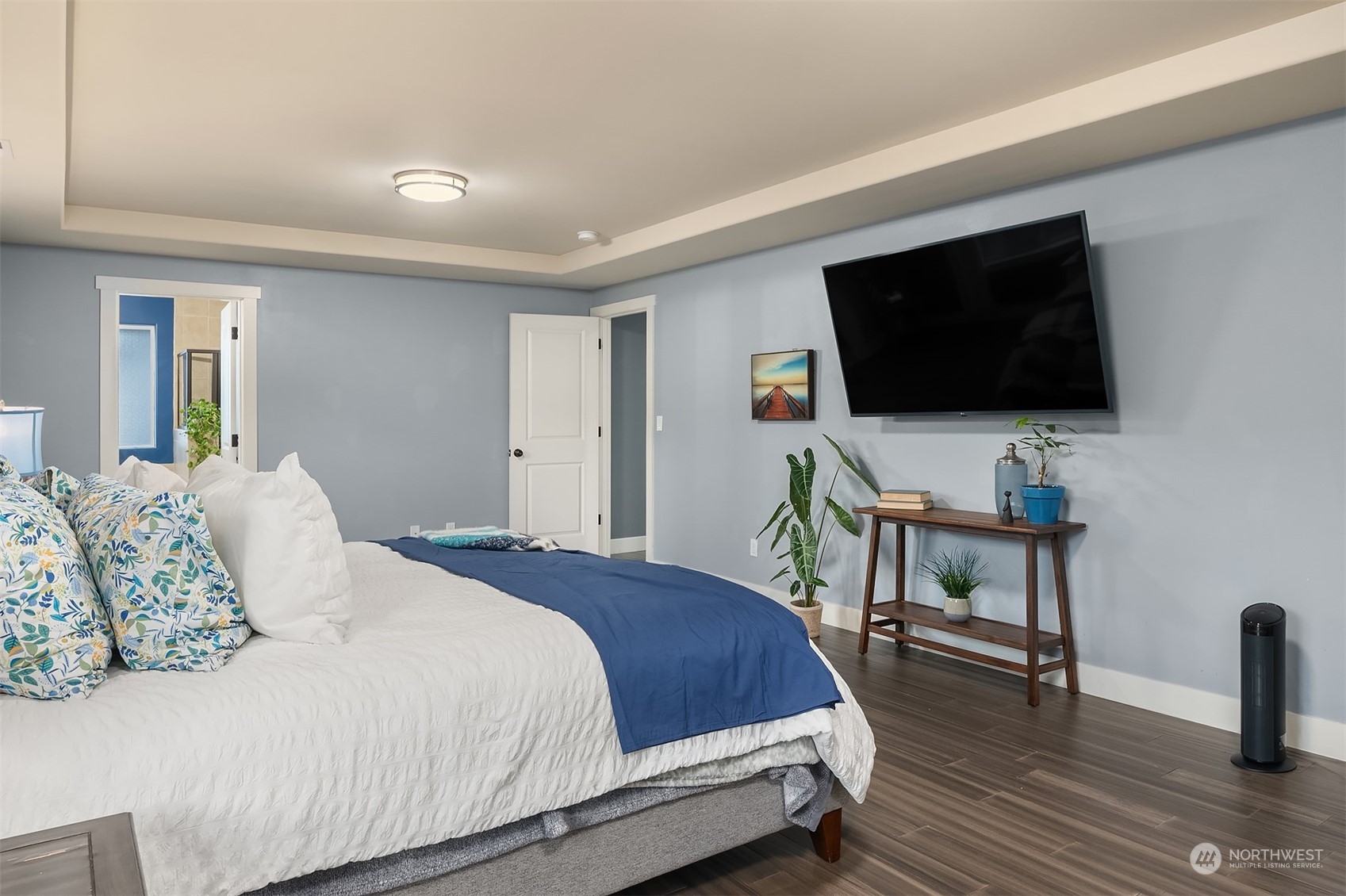 11520 56th Drive Southeast Everett, WA 98208 - Photo 19 of 30 a bedroom with a bed a flat screen tv and a couch