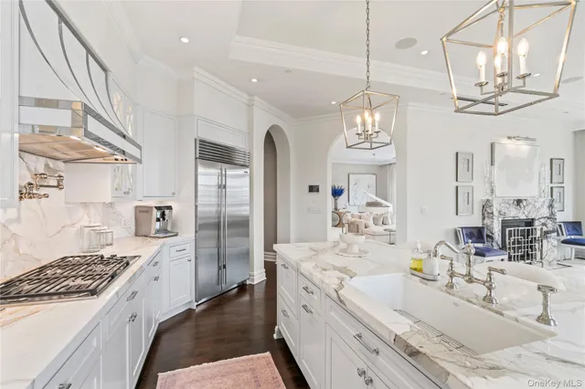 a large bathroom with a granite countertop sink a large mirror and a shower