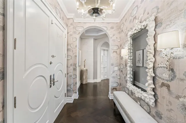 a spacious bathroom with a double vanity sink a mirror a bathtub and shower